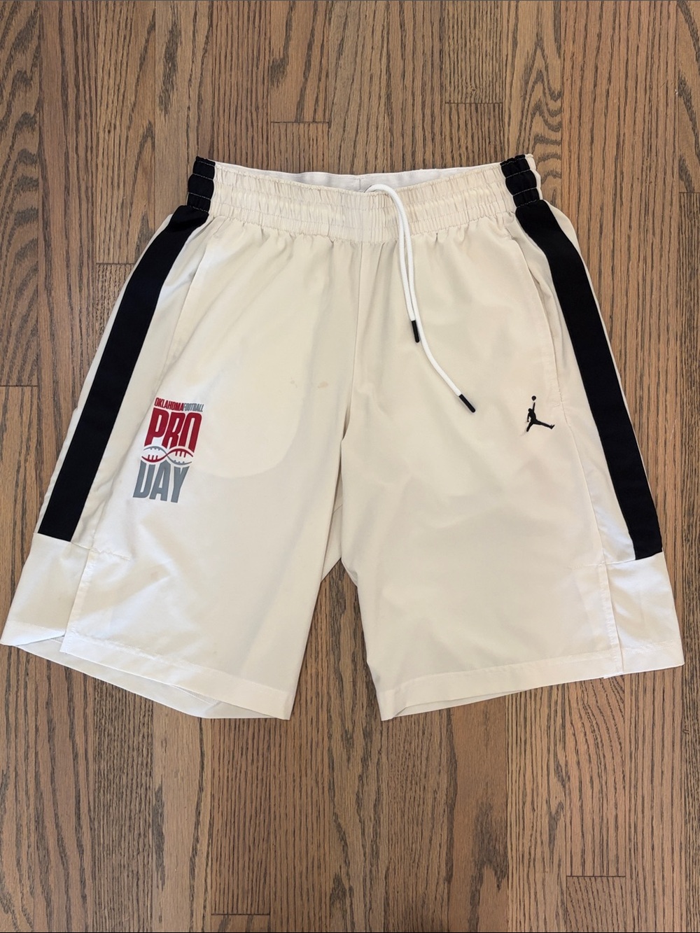 Jordan Men’s White Athletic Shorts with Black Side Panels and Red Pro Day Logo